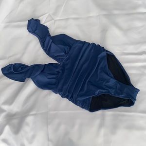 Small Blue one piece swimsuit with ruffle straps.